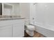 Bright bathroom with a vanity, granite countertop, and shower over tub at 2174 Alyssa St, Fort Lupton, CO 80621