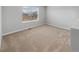 Cozy bedroom featuring plush carpet, neutral walls and ample natural light through the windows at 2174 Alyssa St, Fort Lupton, CO 80621