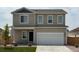 Charming two-story home with a two car garage, neutral siding, and well-maintained lawn at 2174 Alyssa St, Fort Lupton, CO 80621