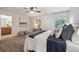 Cozy bedroom with carpet, ceiling fan, and ensuite bathroom at 4231 W Ponds Cir, Littleton, CO 80123