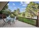 The spacious deck offers outdoor seating with a backyard view at 4231 W Ponds Cir, Littleton, CO 80123