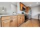 Kitchen featuring wooden cabinets, stainless steel appliances and tiled floor at 4231 W Ponds Cir, Littleton, CO 80123