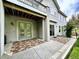 Spacious back patio with door access to backyard, covered balcony, and exterior lighting at 10488 Bluffmont Dr, Lone Tree, CO 80124