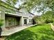 Exterior view of back of home, showing second story balcony and large backyard at 10488 Bluffmont Dr, Lone Tree, CO 80124