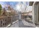 Relax on this wooden balcony that offers great sunlight and a peaceful outdoor space at 10488 Bluffmont Dr, Lone Tree, CO 80124