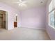 Spacious bedroom features a ceiling fan, closet and ensuite bathroom at 10488 Bluffmont Dr, Lone Tree, CO 80124