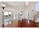 Spacious foyer with hardwood floors, archway, and staircase at 10488 Bluffmont Dr, Lone Tree, CO 80124