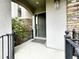 Front entrance with black railings, stone accents and a dark green front door at 10488 Bluffmont Dr, Lone Tree, CO 80124