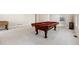 Bright game room with a pool table and foosball table, perfect for entertaining guests and Gathering at 10488 Bluffmont Dr, Lone Tree, CO 80124