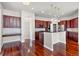 Open kitchen with dark wood cabinets and granite countertops at 10488 Bluffmont Dr, Lone Tree, CO 80124