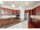 Gourmet kitchen with stainless steel appliances and a large island at 10488 Bluffmont Dr, Lone Tree, CO 80124