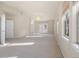 Spacious living room with bright sunlight, lots of room to relax, neutral colors, and a chandelier at 10488 Bluffmont Dr, Lone Tree, CO 80124