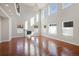 A spacious living room with tall windows and a cozy fireplace at 10488 Bluffmont Dr, Lone Tree, CO 80124