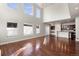 Bright living room with hardwood floors and tall windows at 10488 Bluffmont Dr, Lone Tree, CO 80124