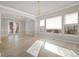Bright living room featuring a chandelier and large windows at 10488 Bluffmont Dr, Lone Tree, CO 80124