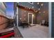 Cozy backyard patio with string lights, outdoor seating, and a mix of concrete and gravel at 744 Grand Market Ave, Berthoud, CO 80513