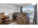 Rustic bedroom featuring a loft bed, wooden furniture, and a window with natural light at 744 Grand Market Ave, Berthoud, CO 80513