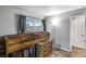 Rustic bedroom featuring a loft bed, wooden furniture, and a window with natural light at 744 Grand Market Ave, Berthoud, CO 80513