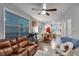 Spacious living room with wood flooring, featuring a comfortable couch and natural light at 744 Grand Market Ave, Berthoud, CO 80513