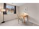 Bedroom featuring neutral paint, carpet and a large window at 6388 Oak Ct # 104, Arvada, CO 80004