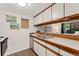 Kitchen showcasing white cabinets, stainless steel appliances, and a functional layout at 6388 Oak Ct # 104, Arvada, CO 80004