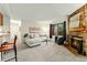 Cozy living room with a fireplace and large windows, providing ample natural light at 6388 Oak Ct # 104, Arvada, CO 80004