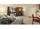 Comfortable living room with carpet, natural light and a stone fireplace at 6388 Oak Ct # 104, Arvada, CO 80004