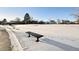 Basketball court with hoop and benches in snowy area at 10975 Birch Dr, Thornton, CO 80233