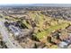 Aerial view of a golf course and the surrounding community, emphasizing the proximity to the green spaces at 3041 S Bellaire S St, Denver, CO 80222