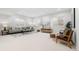 Spacious basement area with plenty of room for living and entertaining with cozy seating at 3041 S Bellaire S St, Denver, CO 80222