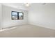 Bedroom showcasing a large window and neutral carpet at 3041 S Bellaire S St, Denver, CO 80222