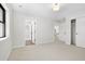 Bright bedroom with carpeted floors, large windows, and neutral color palette at 3041 S Bellaire S St, Denver, CO 80222