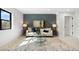 Inviting living room with blue accent wall, designer rug, and ample natural light at 3041 S Bellaire S St, Denver, CO 80222