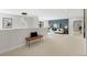 Open loft area with stylish seating, blue accent wall, and modern lighting at 3041 S Bellaire S St, Denver, CO 80222