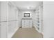 Organized walk-in closet with custom shelving and ample storage space at 3041 S Bellaire S St, Denver, CO 80222