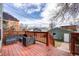 Outdoor back deck with cozy patio furniture and wood railing at 3932 Tejon St, Denver, CO 80211