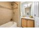 Cozy bathroom with tiled shower-tub combination and granite vanity countertop at 3932 Tejon St, Denver, CO 80211