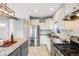 Well-equipped kitchen with stainless steel appliances, granite countertops, and tile backsplash for a modern touch at 3932 Tejon St, Denver, CO 80211