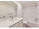 Contemporary bathroom with white vanity, tub-shower combo, and modern fixtures at 1286 S Algonquian St, Aurora, CO 80018