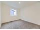 Comfortable bedroom with neutral carpeting, a window, and ample natural light at 1286 S Algonquian St, Aurora, CO 80018