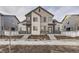 Modern two-story home with stone accents, large windows, and inviting front entrances at 1286 S Algonquian St, Aurora, CO 80018