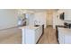Open-concept kitchen with stainless steel appliances and a center island at 1286 S Algonquian St, Aurora, CO 80018
