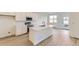 Modern kitchen featuring white cabinets, quartz countertops, and stainless steel appliances at 1286 S Algonquian St, Aurora, CO 80018