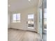 Bright room with natural light, a glass patio door, and neutral-toned flooring at 1286 S Algonquian St, Aurora, CO 80018