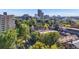 Stunning elevated view capturing a dynamic blend of dense foliage and urban structures in the neighborhood at 1372 Gaylord St # 4, Denver, CO 80206
