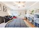 Comfortable bedroom with large bed, ceiling fan, and ample closet space at 1372 Gaylord St # 4, Denver, CO 80206