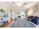 Spacious bedroom with a plaid comforter, and a full bookshelf at 1372 Gaylord St # 4, Denver, CO 80206
