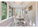 Charming dining room with a round table, four chairs, and bright, natural light at 1372 Gaylord St # 4, Denver, CO 80206