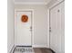 Cozy entryway featuring a white front door adorned with a festive wreath and a welcoming doormat at 1372 Gaylord St # 4, Denver, CO 80206