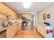 Well-lit kitchen with wooden cabinets, granite countertops, and stainless steel appliances at 1372 Gaylord St # 4, Denver, CO 80206